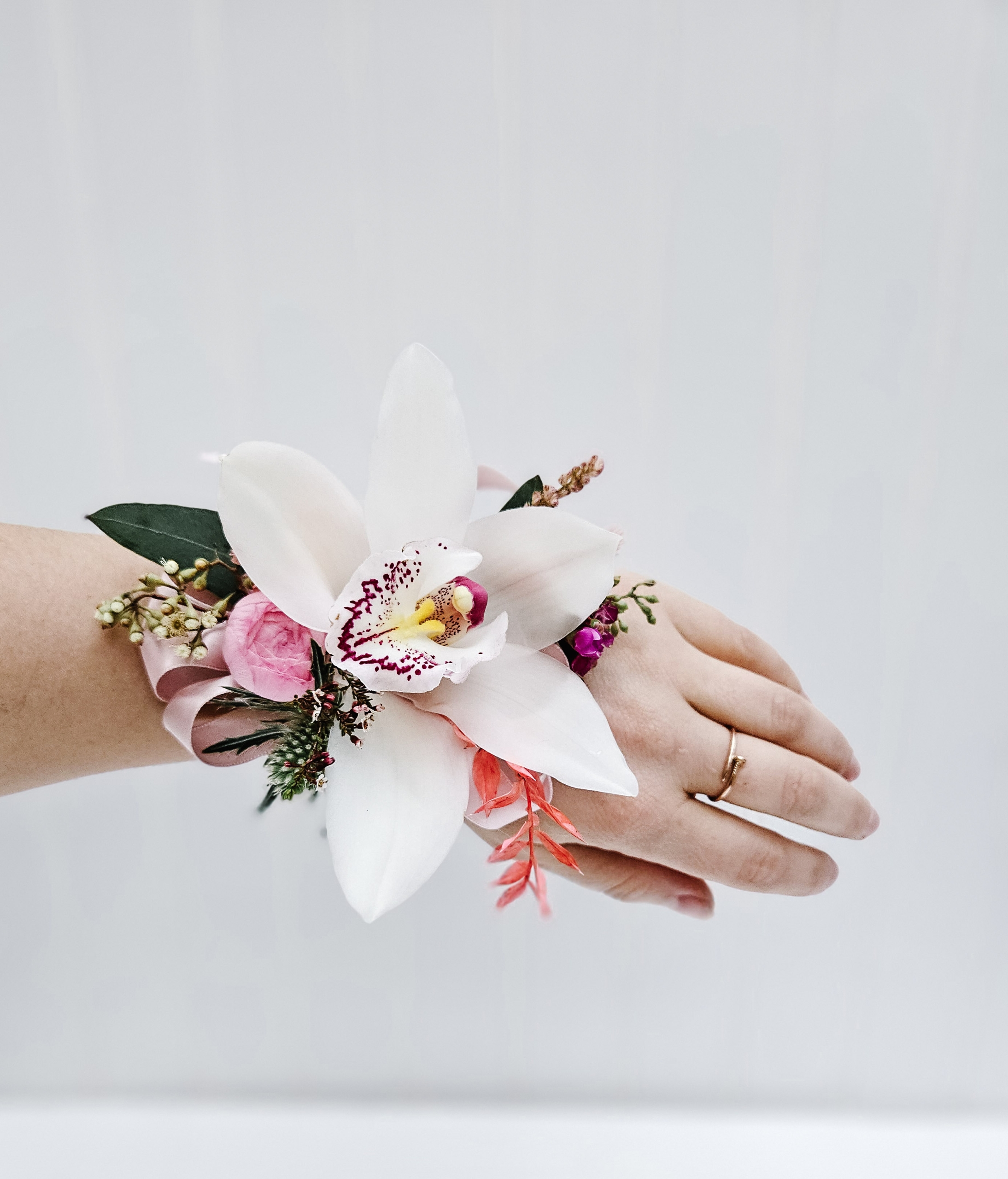 White toned orchid corsage.