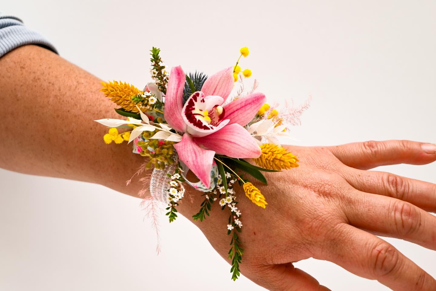 Yellow and pink pastel toned corsage.