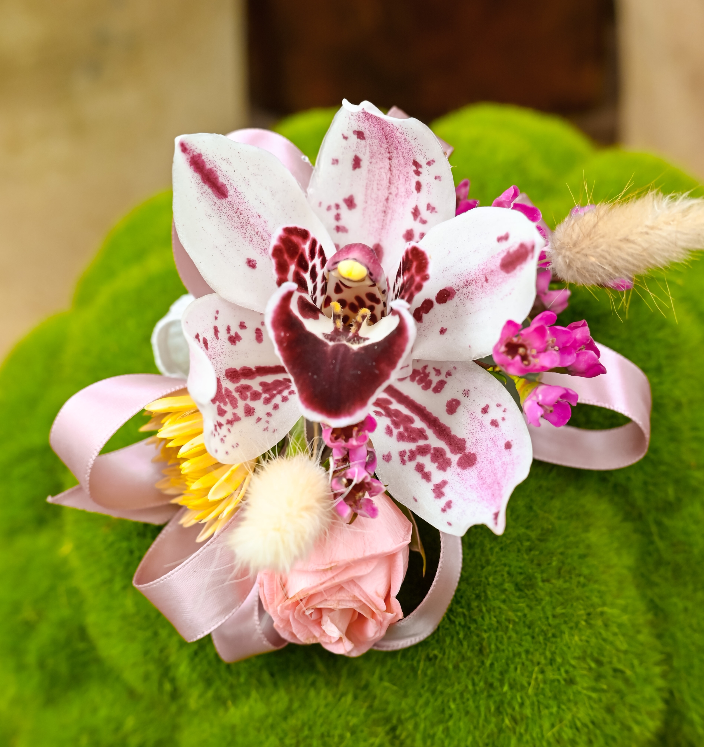 Light pink and light orchid corsage.